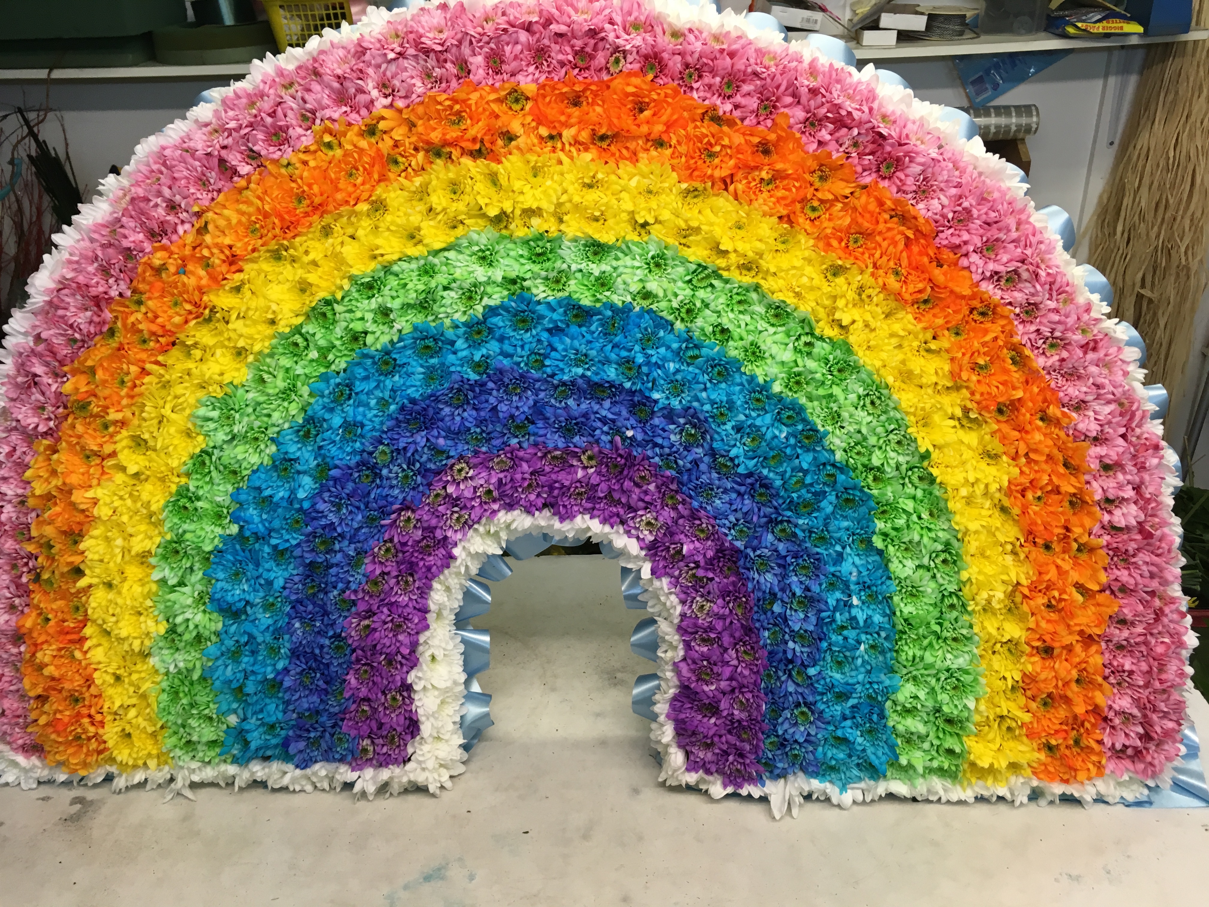 rainbow arch made from flowers