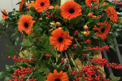 Contemporary Design of Gerberas with candle coffin spray