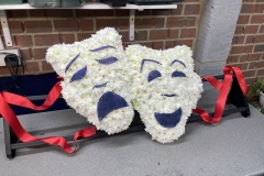 theatre mask made from flowers